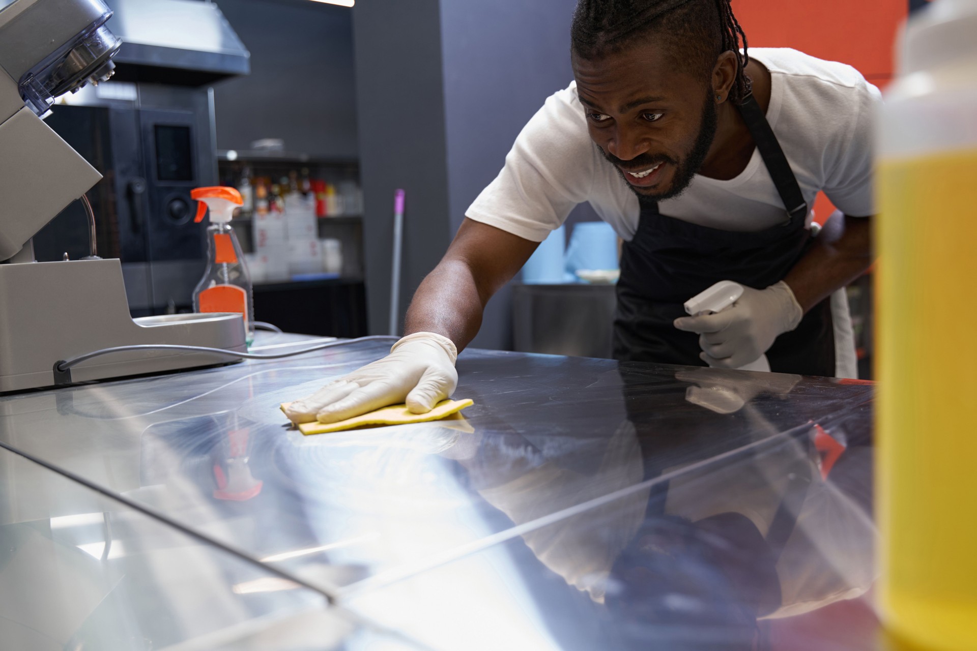 Chef cleaning work place after hard working
