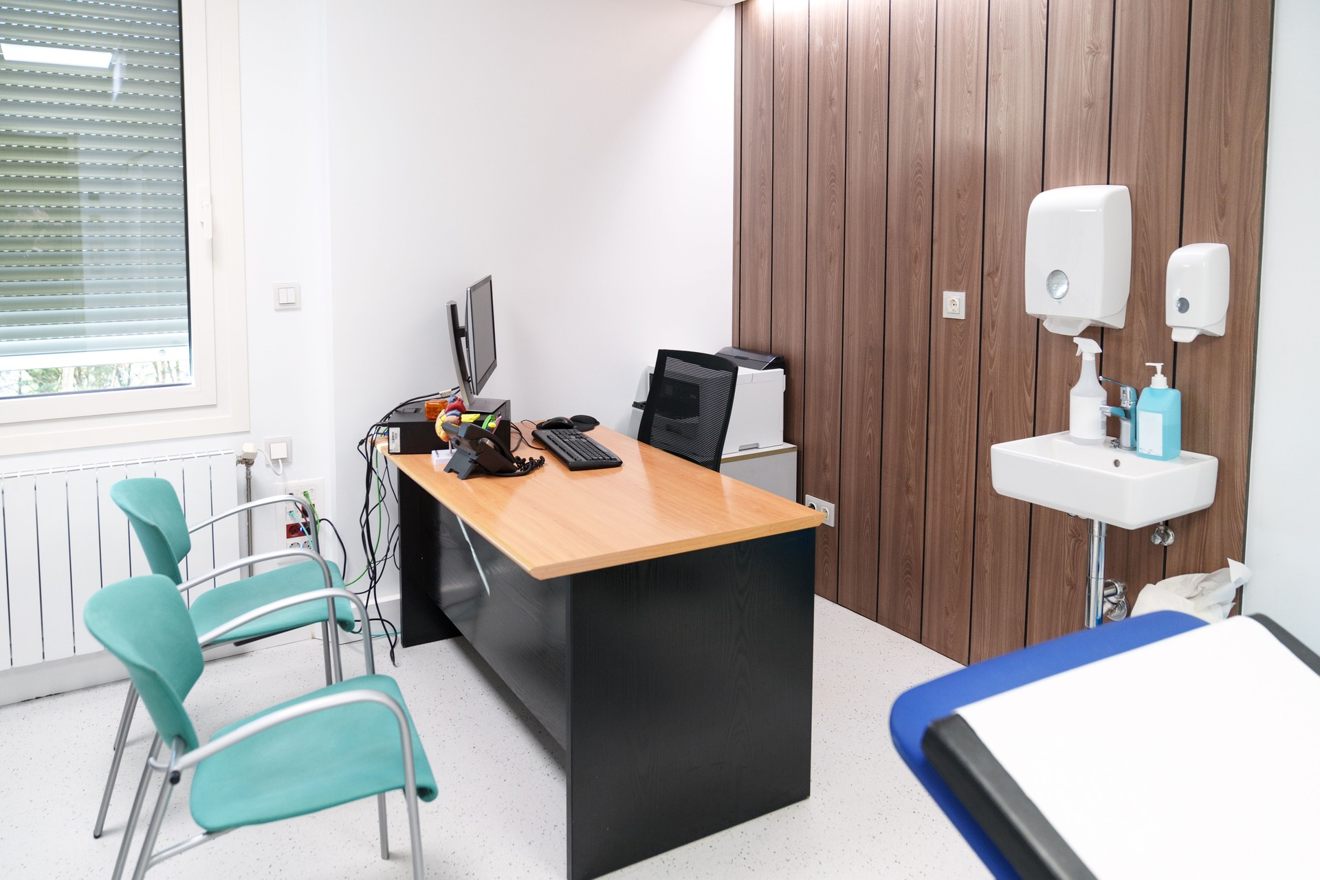 Organized Doctor's Office with Computer Desk and Hygiene Station